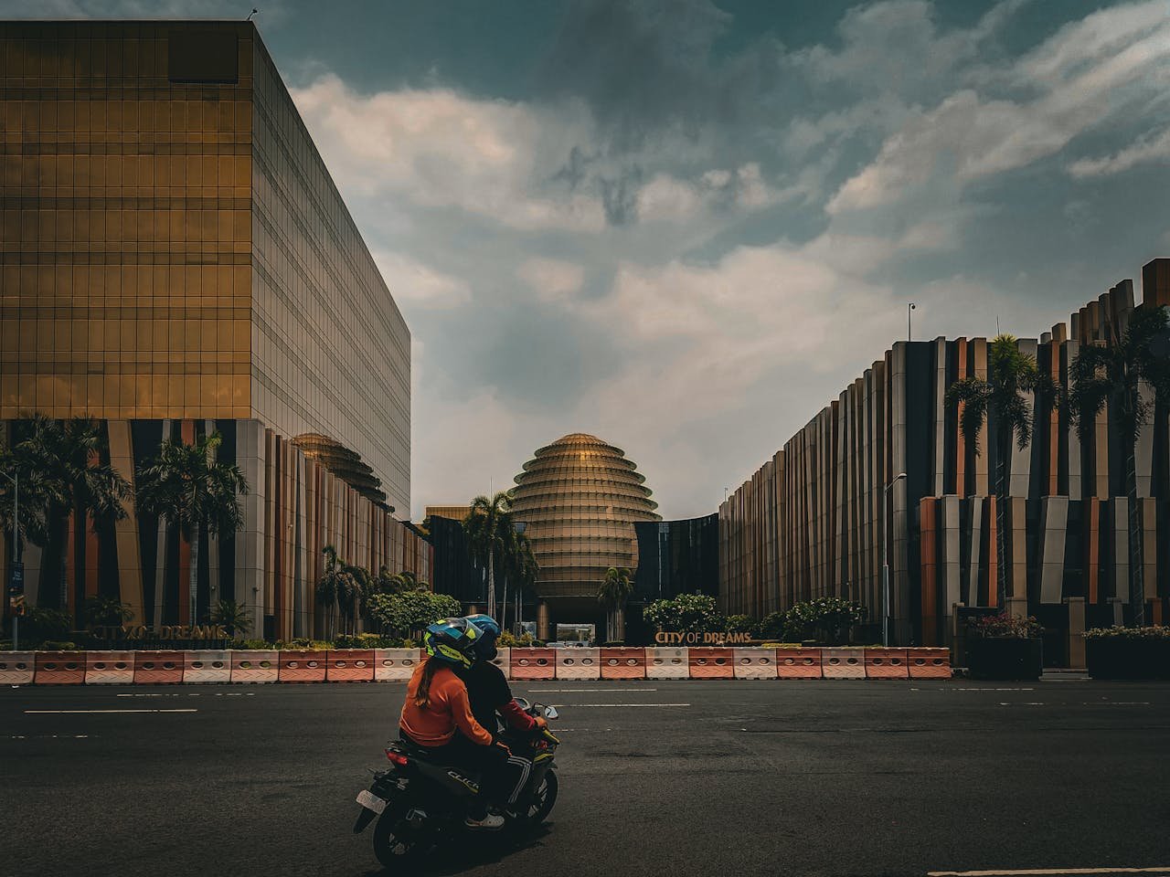 Photo by Kimy Moto: https://www.pexels.com/photo/people-riding-on-a-motorcycle-on-a-street-near-the-city-of-dreams-manila-hotel-manila-philippines-24497265/